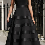 Antonella | Black sleeveless midi dress with flared skirt and defined waist