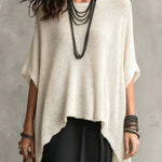 Open-knit round-neck top with an asymmetrical hem