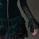 Dark green velvet mini dress with lace sleeves
