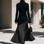 Black half-zip maxi dress with pinstriped hem panel
