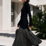 Black half-zip maxi dress with pinstriped hem panel