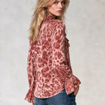 Women's pink leopard-print satin long-sleeve shirt featuring a ruffled front and ruffled cuffs
