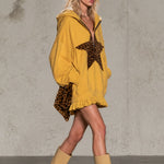 Mustard Yellow Half-zip Hooded Sweatshirt Dress Featuring Leopard-print Star Appliqués And A Ruffled Hem