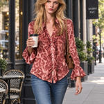 Women's pink leopard-print satin long-sleeve shirt featuring a ruffled front and ruffled cuffs