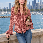 Women's pink leopard-print satin long-sleeve shirt featuring a ruffled front and ruffled cuffs
