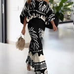 2 Pieces Outfit Skew Neck Lantern Sleeve Loose Fit Top and High Waist Elastic Waist Fishtail Maxi Skirt Set Casual Tropical Print Vacation Set