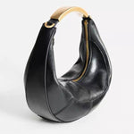 Metal handle crescent bag