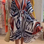 Margovil V Neck Lantern Sleeve Tie Waist Printed Irregular Swing Dress