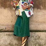 White denim overshirt embroidered with bright colors and pockets