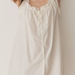 Short Skirt with Pearl Buttons and Scalloped Trim and Round Neck.