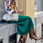 White denim overshirt embroidered with bright colors and pockets