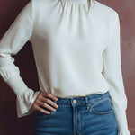 Elegant High Neck White Blouse With Smocked Cuffs And Ruffle Details