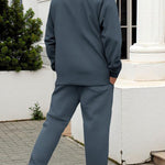 KZZ Men's two-piece casual suit with a stand-up collar long sleeves with a subtle texture