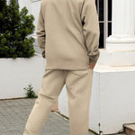 KZZ Men's two-piece casual suit with a stand-up collar long sleeves with a subtle texture