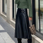 Metal buckle-embellished mid-length A-line leather skirt