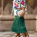 White denim overshirt embroidered with bright colors and pockets