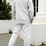 KZZ Men's two-piece casual suit with a stand-up collar long sleeves with a subtle texture