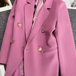 Metal-buttoned double-breasted suit jacket