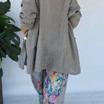 Set of green jacket and wide trousers with floral print