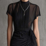 Barbara | Short black chiffon dress with pleats at the waist and lace trim