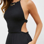 Solid color halter neck open back flared jumpsuit