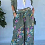 Set of green jacket and wide trousers with floral print