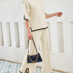 Nadorine Contrasting Color Slit Short-sleeved Sweater Wide-leg Trousers Two-piece Set