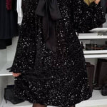 Sequined long-sleeved party dress with bow on the back