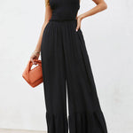 Solid color halter neck open back flared jumpsuit