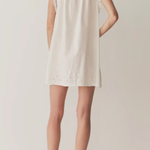 Short Skirt with Pearl Buttons and Scalloped Trim and Round Neck.