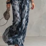 Séverine™ | Elegant navy halter neck top with printed wide-leg trousers