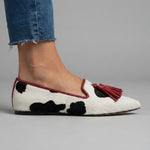 Ginevra Moccasin — Black and White Cow Print, Red Tassels