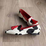 Ginevra Moccasin — Black and White Cow Print, Red Tassels